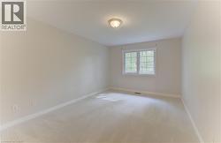 Recessed window with white trim, light-toned carpeting, and a flush-mount ceiling light fixture (NEW CARPET) - 