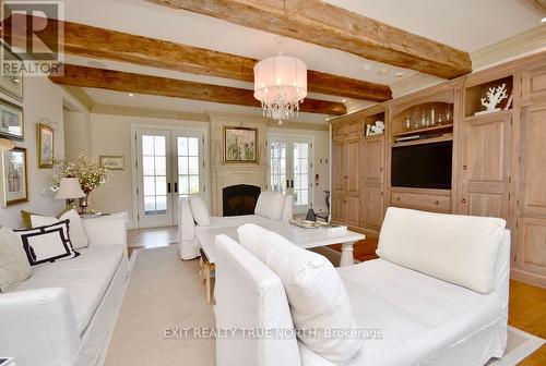 Inviting family room with custom built-ins - 3021 Sandy Bend, Springwater, ON 