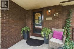 Brick exterior featuring a covered entry - 