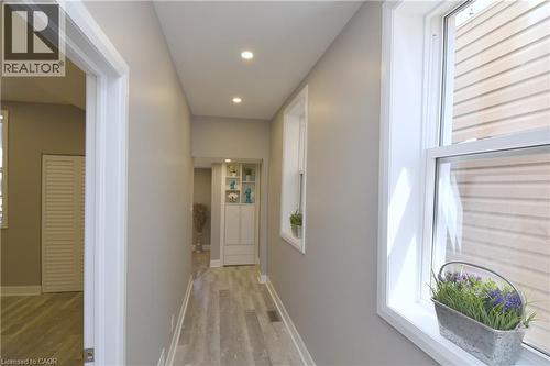Recessed lighting illuminates wood-finish flooring - 76 Burlington Street E, Hamilton, ON 