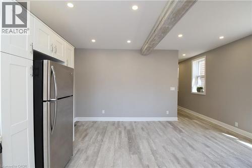 Wood-finish flooring with white trim - 76 Burlington Street E, Hamilton, ON 