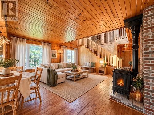 Living & dining room staged using A.I. - 157 Kimberley Farm Drive, Winterland, NL 