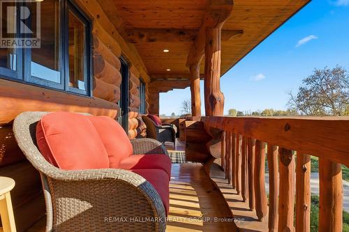 Covered porch overlooking grounds - 11709 County  38 Road, North Dundas, ON 