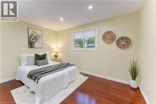 Recessed lighting, wood-finish flooring, and a window with a roller blind - 422 Grangewood Drive, Waterloo, ON 