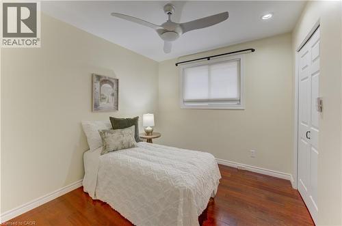 Wood-finish flooring, recessed lighting, and a ceiling fan - 422 Grangewood Drive, Waterloo, ON 