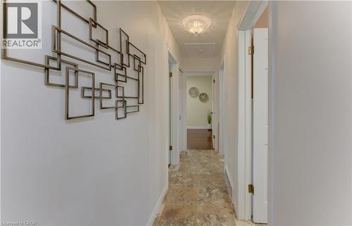 Recessed ceiling lighting, a decorative semi-flush mount light fixture, and tile flooring - 422 Grangewood Drive, Waterloo, ON 
