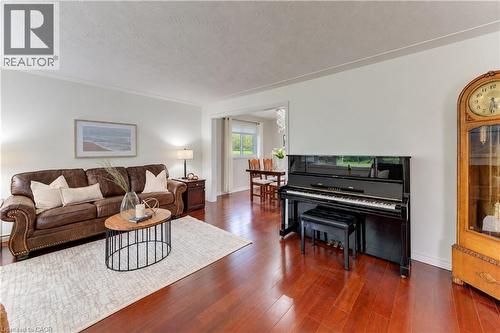 Hardwood-finish flooring, white wall paint, crown molding, and a wide entryway - 422 Grangewood Drive, Waterloo, ON 