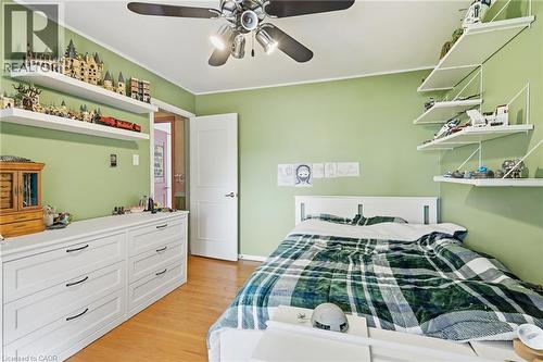 Wood-finish flooring with a ceiling fan light fixture - 1311 W Concession 6 Road, Flamborough, ON 