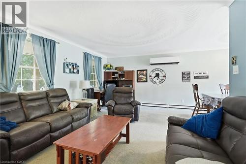 Open-concept living area featuring multiple windows, light-toned wall paint, - 1311 W Concession 6 Road, Flamborough, ON 