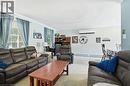 Open-concept living area featuring multiple windows, light-toned wall paint, - 1311 W Concession 6 Road, Flamborough, ON 
