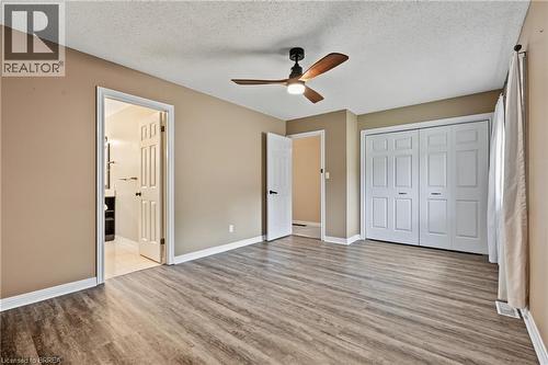 Neutral-toned walls complement wood-finish flooring - 141 Race Street, Paris, ON 