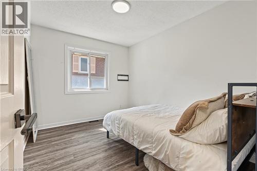 Wood-finish flooring, white walls, white trim, recessed lighting, and a double-paned window - 141 Race Street, Paris, ON 