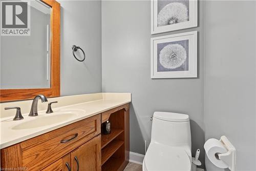 Vanity with wood-finish cabinetry, integrated sink, and bronze-finish faucet - 141 Race Street, Paris, ON 