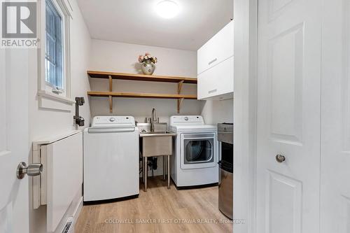 Main floor laundry with extra shelving and sink - 25 Robert Road, Perth, ON 