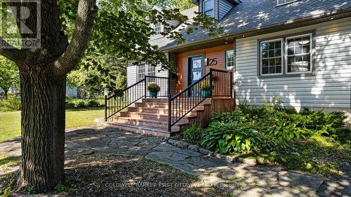 Stone walkway leading to inviting porch - 25 Robert Road, Perth, ON 