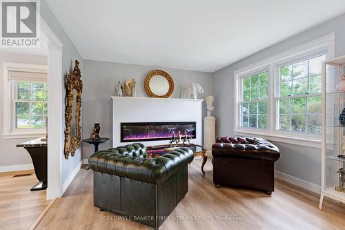 Cozy sitting space with electric fireplace - 25 Robert Road, Perth, ON 