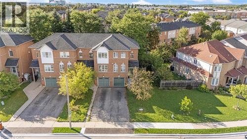 Brick exterior with gabled roofline and attached garage - 123 Brickyard Way, Brampton, ON 