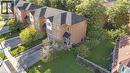 Brick exterior with multiple windows, black shingle roof, and an attached garage - 123 Brickyard Way, Brampton, ON 