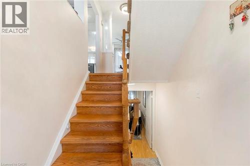 Hardwood staircase with natural wood railings - 123 Brickyard Way, Brampton, ON 