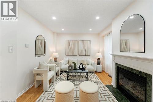 Recessed lighting and wood-finish flooring in a bright interior space - 123 Brickyard Way, Brampton, ON 