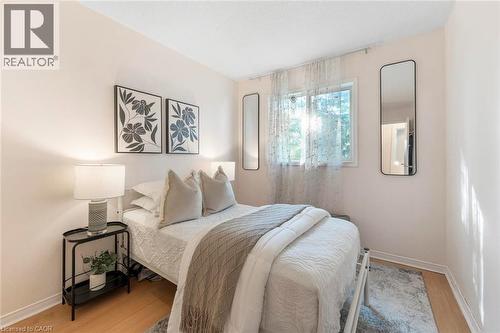 Light wood-finish flooring, recessed window, and light-toned wall finishes - 123 Brickyard Way, Brampton, ON 