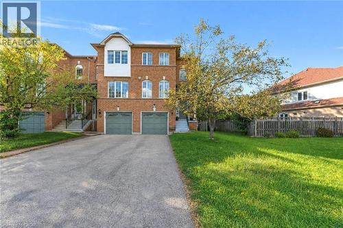 Brick facade featuring architectural details and white trim - 123 Brickyard Way, Brampton, ON 