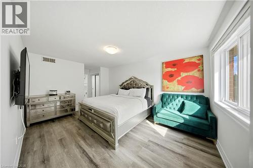 Wood-finish flooring with white walls and a white ceiling - 167 Broadoaks Drive, Cambridge, ON 