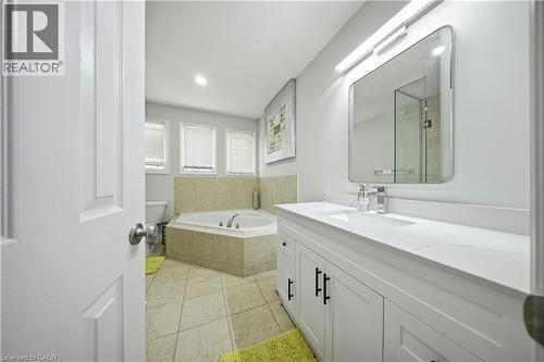 White shaker vanity with a white countertop and rectangular undermount sink - 167 Broadoaks Drive, Cambridge, ON 