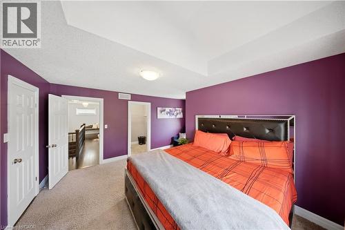 Recessed ceiling detail, plush carpet flooring, panel doors, and overhead lighting - 167 Broadoaks Drive, Cambridge, ON 