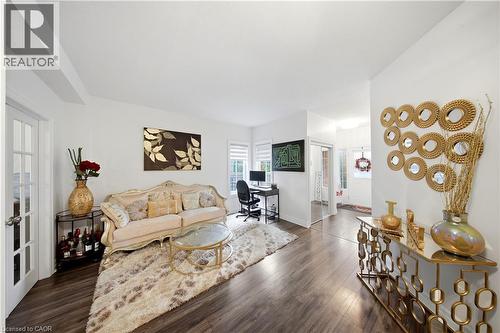 Wood-finish flooring throughout, white painted walls, and a white ceiling create a bright interior - 167 Broadoaks Drive, Cambridge, ON 