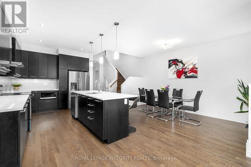Living room facing kitchen and dining room - 641 Odyssey Way, Ottawa, ON 