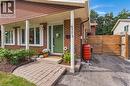 Brick exterior featuring a covered entry with white columns - 477 Kingscourt Drive Unit# B, Waterloo, ON 