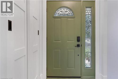 Entry door with an arched decorative glass transom and a full-length decorative glass sidelight - 477 Kingscourt Drive Unit# B, Waterloo, ON 