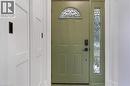 Entry door with an arched decorative glass transom and a full-length decorative glass sidelight - 477 Kingscourt Drive Unit# B, Waterloo, ON 