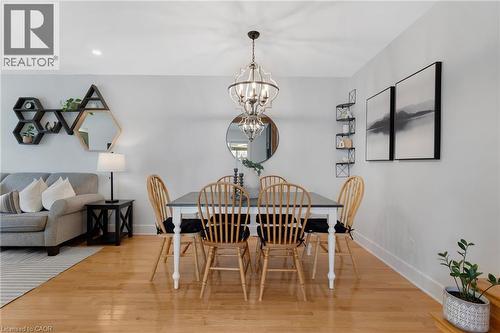 Hardwood-finish flooring, recessed lighting, and a chandelier with a metal frame and clear glass accents - 477 Kingscourt Drive Unit# B, Waterloo, ON 