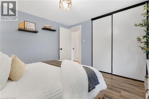 Wood-finish flooring with a light-toned wall color - 477 Kingscourt Drive Unit# B, Waterloo, ON 