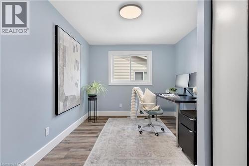 Wood-finish flooring, white trim, and a window with a white frame - 477 Kingscourt Drive Unit# B, Waterloo, ON 
