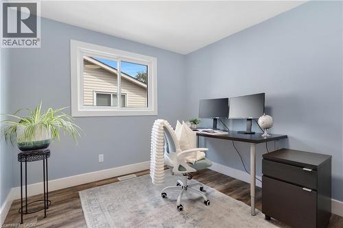 Window with white trim and wood-finish flooring - 477 Kingscourt Drive Unit# B, Waterloo, ON 