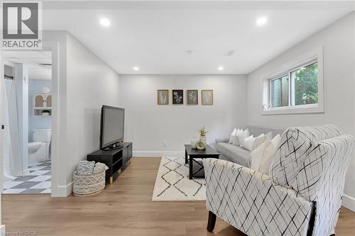 Recessed lighting, wood-finish flooring, and a window with white trim - 477 Kingscourt Drive Unit# B, Waterloo, ON 