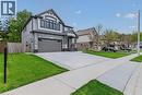 Contemporary two-story residence featuring a gray brick and siding facade - 249 Woodway Trail, Simcoe, ON 