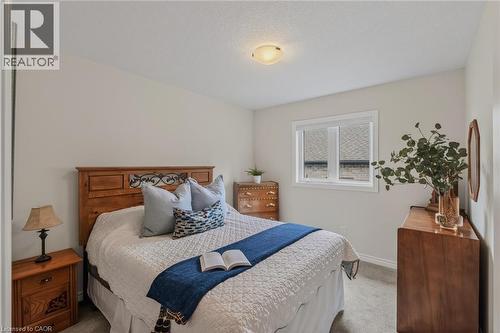 Room featuring neutral-toned walls and carpet flooring - 249 Woodway Trail, Simcoe, ON 