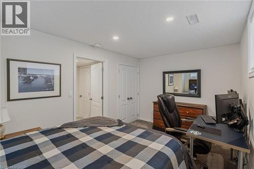 Carpeted room featuring light gray walls and recessed ceiling lighting - 249 Woodway Trail, Simcoe, ON 