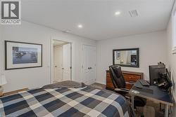 Carpeted room featuring light gray walls and recessed ceiling lighting - 