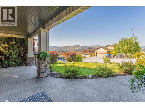 spacious and inviting front patio ~ so many lounging areas! - 1113 Mt Fosthall Drive, Vernon, BC 