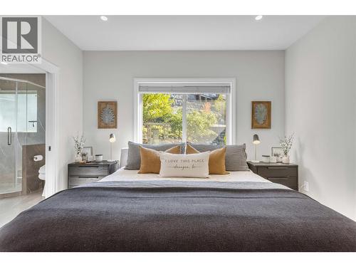 primary bedroom faces rear yard green space - 1113 Mt Fosthall Drive, Vernon, BC 