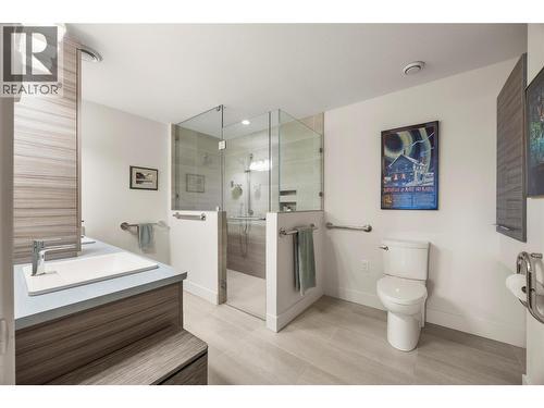 PRIMARY 4 PC ENSUITE: Elegant ensuite with dual sinks, curbless walk-in shower with custom tile surround and glass door, plus heated tile flooring - 2442 Bella Vista Street, Kelowna, BC 