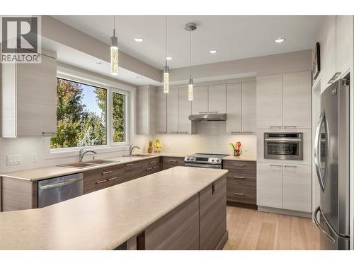 The kitchen includes all SS appliances plus a 24” Jennair steam oven that can also be used as a second convection oven - 2442 Bella Vista Street, Kelowna, BC 