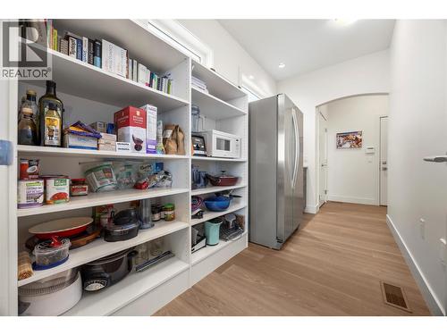 Walk through pantry with built in shelves and second fridge - 2442 Bella Vista Street, Kelowna, BC 