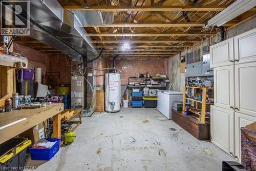 Unfinished lower level featuring exposed ceiling joists, concrete flooring, and an exposed ventilation system - 123 Mill Street, Delhi, ON 