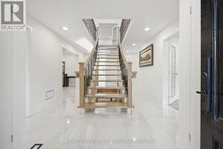 Foyer with Open Riser Staircase - 